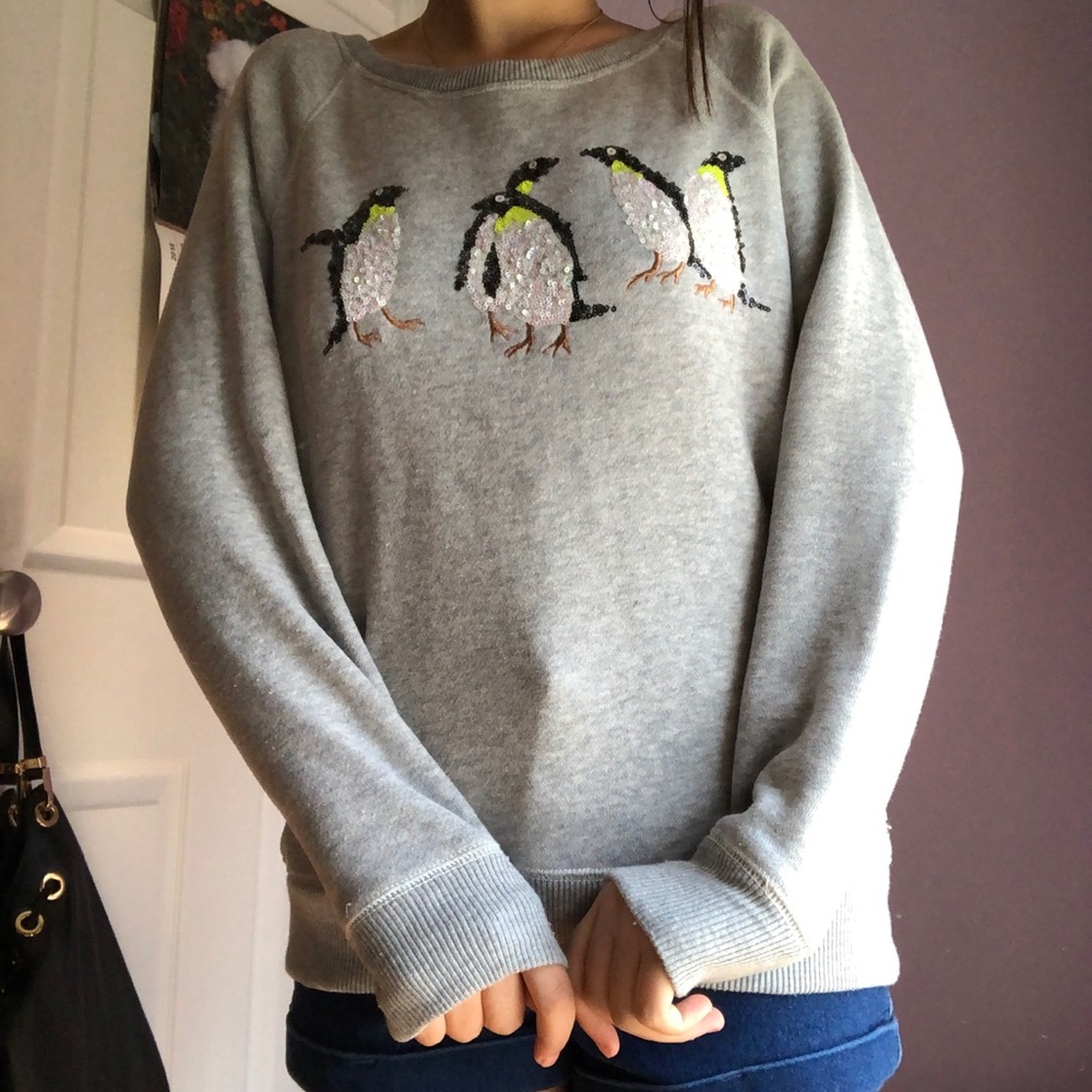 gray sweater with penguins